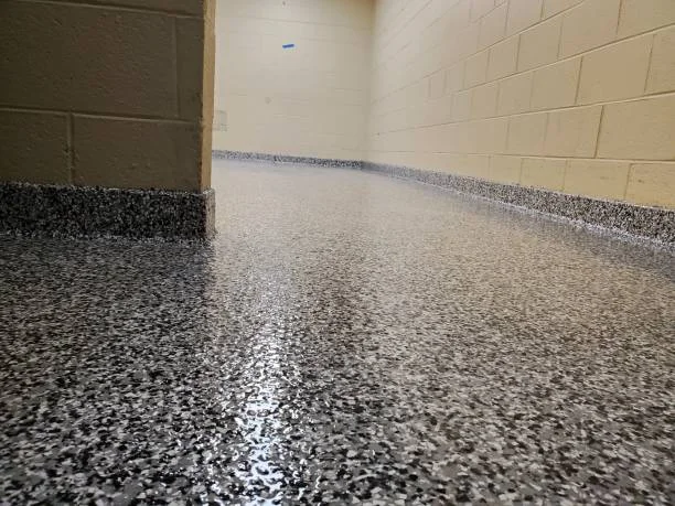Epoxy garage floor with charcoal and white flake aggregate and glossy topcoat finish